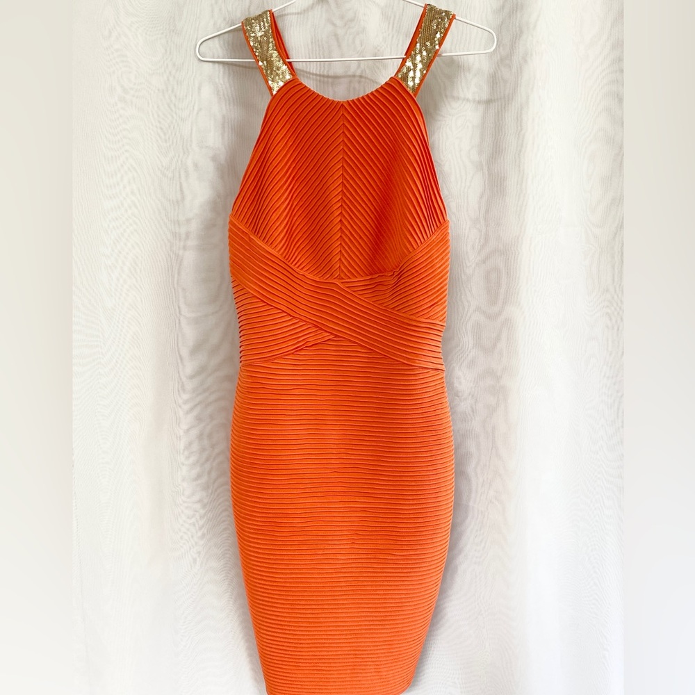 Calvin Klein cocktail dress. Coral orange pleated fabric with gold sequin straps